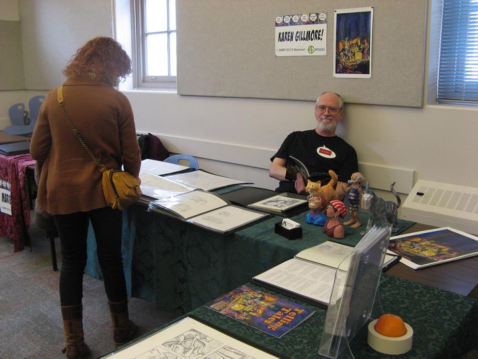 My table last year at CCAF (which was then called the Camosun College Comics Conference — we were into alliteration!). I got a luxurious amount of space last year! That's my handsome hubby, Ron, holding down the fort while I take pictures.